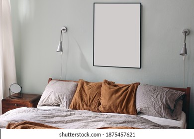 Portrait Black Picture Frame Mockup And Silver Lamps On Sage Green Wall. Bedroom View.  Grey Linen And Rusty Muslin Pillows On Wooden Bed. Mirror On Retro Bedside Table. Scandinavian Interior.