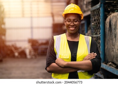 Portrait Black smart African women worker standing happy smiling in factory industry workplace - Shutterstock ID 2044056773