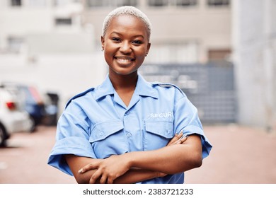 Portrait, black woman and security guard smile with arms crossed in surveillance service, safety and city patrol. Law enforcement, proud bodyguard or happy female police officer in blue shirt outdoor - Powered by Shutterstock