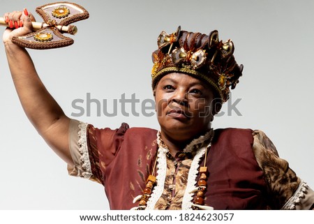 Portrait of black woman with typical crown of religion of African origin in Brazil, representing the Orisha