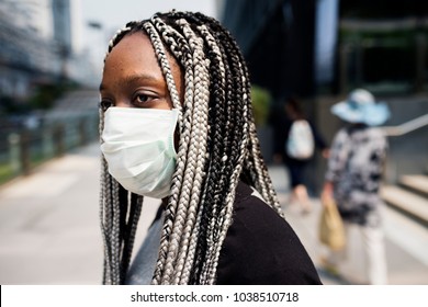 Portrait Of Black Woman Wearing Mask