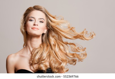 Portrait Of Blond Beauty With Amazing Long Healthy Hair.