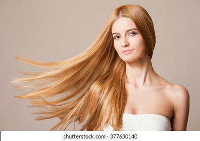 Portrait of a blond beauty with beautiful healthy long hair.