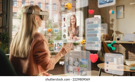 Portrait of a Blond Caucasian Female Using VR to Connect to Friends While Sitting in Stylish Cozy Loft Living Room. Woman Getting Online Using Metaverse Software to Chat and Meet People - Powered by Shutterstock