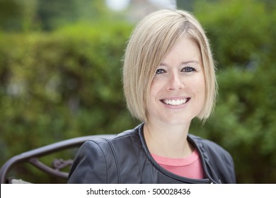 Portrait Of A Blond Woman Smiling.Outside