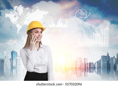 Portrait of blond woman wearing hard hat and talking on smartphone. A city is in the background. World map and graphs in the sky. Toned image. Double exposure. Elements of this image furnished by NASA