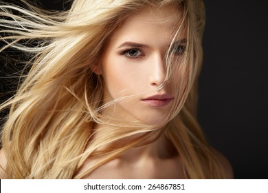 Portrait of blonde girl with fluttering hair