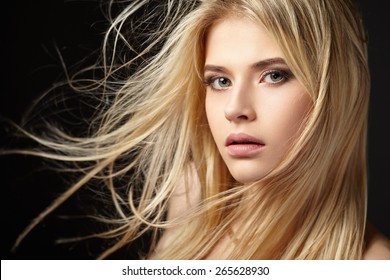 Portrait of blonde girl with fluttering hair