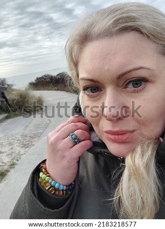 Portrait of a blonde model girl on holiday