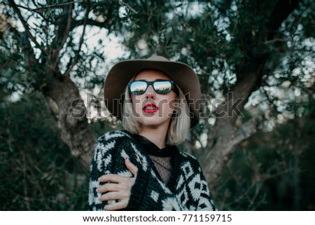 Similar – Image, Stock Photo Blonde woman portrait with the hands in her hat, discovering the forest.