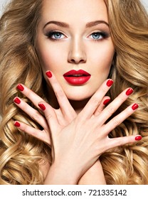 Portrait Of The Blonde Woman With Long  Hair And Red Nails. Fashion Model With Bright Makeup.