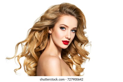 Portrait of the blonde woman with long  hair and red lips. Fashion model with bright makeup.