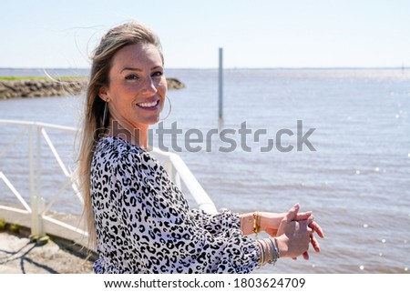 Portrait of blonde woman on summer vacation beach