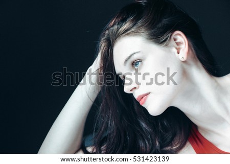 portrait of a blue eye swedish woman with black background 