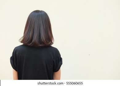 Portrait Bob Hair Style And Medium Dark Brown Hair Woman On White Wall Background.