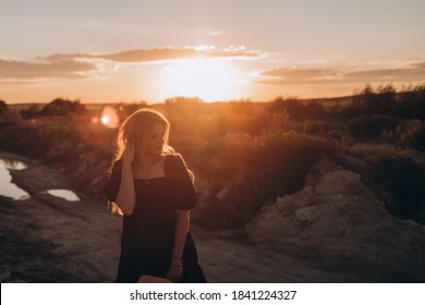 Portrait of boho woman in hat posing in summer countryside in evening. Atmospheric moment - Shutterstock ID 1841224327