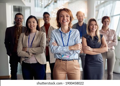 portrait of bold and outgoing group of successful business people, looking at camera. eye contact - Shutterstock ID 1900458022