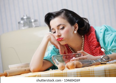 Portrait of a bored housewife in the kitchen - Powered by Shutterstock