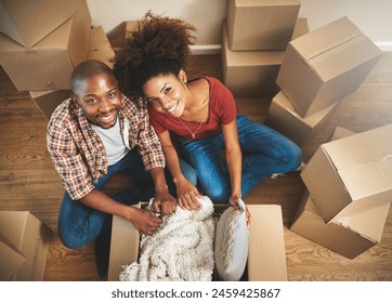 Portrait, boxes and black couple on floor in new home with moving, smile and mortgage with top view. Relax, man and happy woman in apartment together with packing, love and property investment. - Powered by Shutterstock