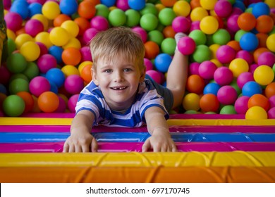 Portrait of a boy in balls on a playground.
 - Shutterstock ID 697170745