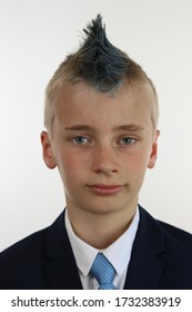 Portrait Of A Boy With A Blue Mohawk Wearing A Business Suit