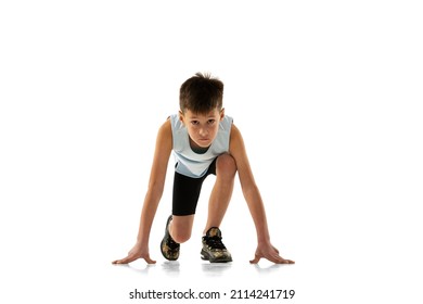 Portrait of boy, child, athlete standing on position to run isolated over white background. Ready, steady, go. Concept of action, sport, healthy life, competition, motion, physical activity and ad - Powered by Shutterstock