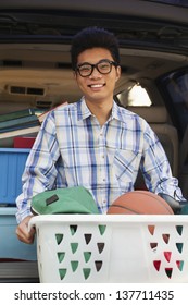 Portrait Of Boy With College Dorm Items In Back Of Car