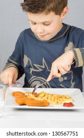 Portrait Of A Boy Eating Dinner Battered Fish And Chips