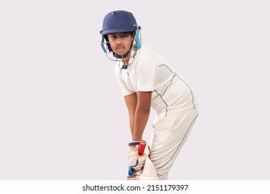 Portrait of boy getting ready to strike During a Cricket Game