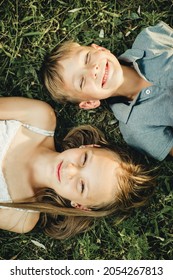 portrait of a boy and a girl on the grass