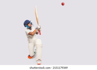 Portrait of boy hitting a shot During a Cricket Game - Powered by Shutterstock