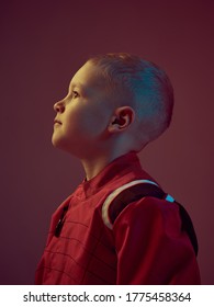 Portrait Of Boy Kid Racer In Racing Suit, Standing In Neon Light. Kart Racing School Poster. Competition Announcement