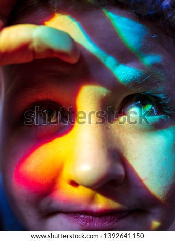 Similar – Abstract portrait of a young woman looking at camera