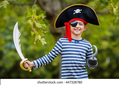 Portrait of boy pretending to be a pirate in the park - Powered by Shutterstock