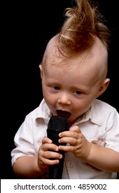 Portrait Of The Boy, Singing In A Microphone, With A Ridiculous Hairdress