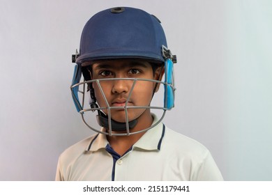 Portrait of boy wearing cricket Helmet