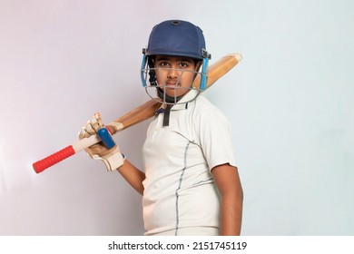 Portrait of boy wearing cricket Helmet and holding Bat