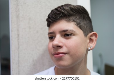 Portrait Of Boy Wearing Earring And With Modern Haircut