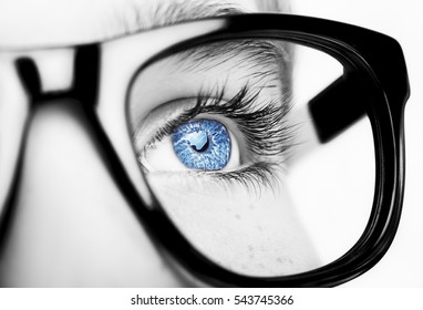 Portrait of a boy wearing eyeglasses blue eyes close, macro studio shot - Powered by Shutterstock
