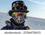 Portrait of a boy wearing a steampunk costume. Halloween costume. Mechanical mask against viruses. Steampunk Fashion.