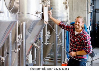 Portrait Of Brewery Worker Checking Fermentation Process - Powered by Shutterstock