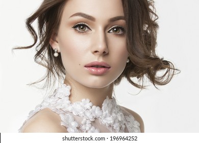 Portrait of the bride with big beautiful eyes on white background