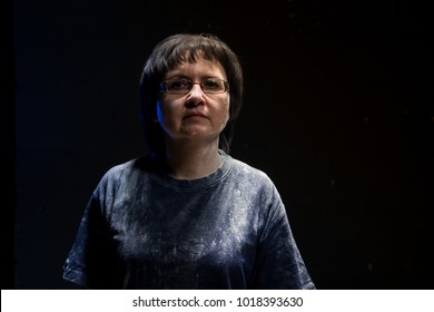 Portrait Of Brunette Adult Woman With Black Background