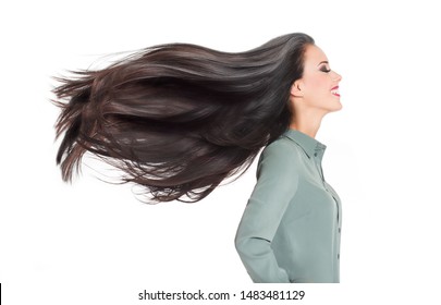 Portrait of a brunette beauty showing off amazing long hair.