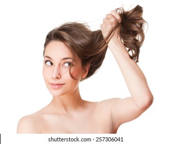 Portrait Of A Brunette Beauty With Strong Healthy Hair.