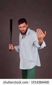 Portrait Of Brutal, Bearded, Aggressive, Big Person With Baseball Bat In Hand On Dark Background. Angry Human Bodyguard With Stern Look. Mafia Man Is Ready To Protect Against Violence And Underground