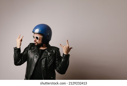 Portrait Of Brutal Bearded Biker In Leather Jacket And Blue Motorcycle Helmet.