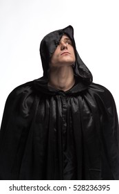 Portrait Of A Brutal Man In A Black Robe