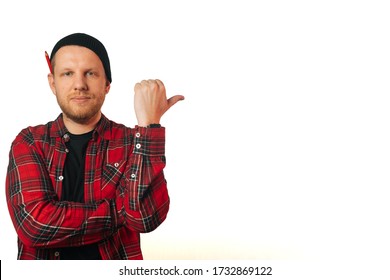 Portrait Of A Brutal Successful Builder, On A Light Background. Average Plan Of A Man In A Plaid Work Shirt.Isolation, Copy Space Next To A Person.