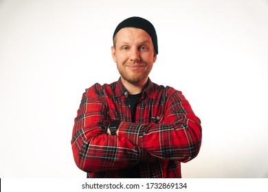 Portrait Of A Brutal Successful Builder, On A Light Background. Average Plan Of A Man In A Plaid Work Shirt..Isolation, Copy Space Next To A Person.